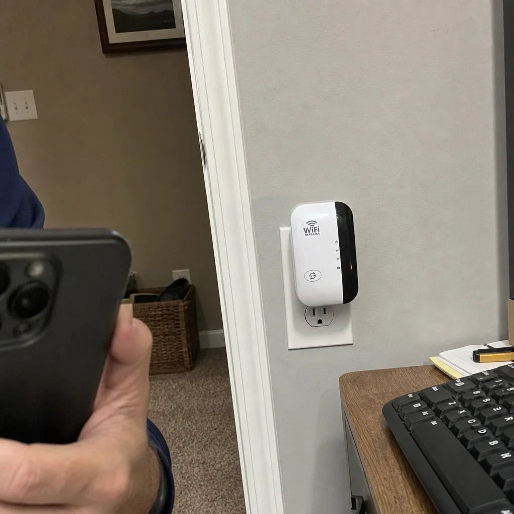 A customer's phone photo taken because of the fit of the exact FENVI Wi-Fi repeater in a distant roo